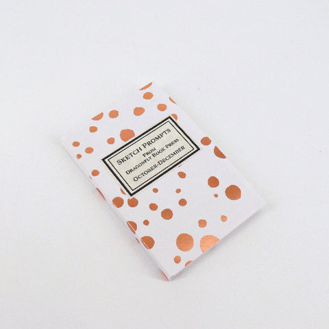 Notebook with polka dot cover on a white background