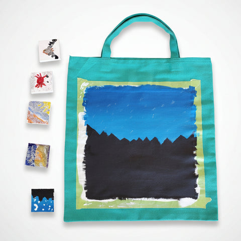 Painted tote bag created during Summer Art Club classes by Arts and Heritage Foundation St. Albert, featuring colorful artistic designs.