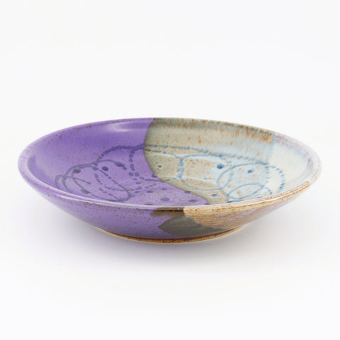 Purple Yin and Yang bowl by Shirley Randall, handcrafted pottery with a purple glaze and symbolic design