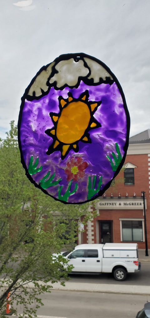 Colorful window cling art created by students in Summer Art Club classes at Arts and Heritage Foundation St. Albert.